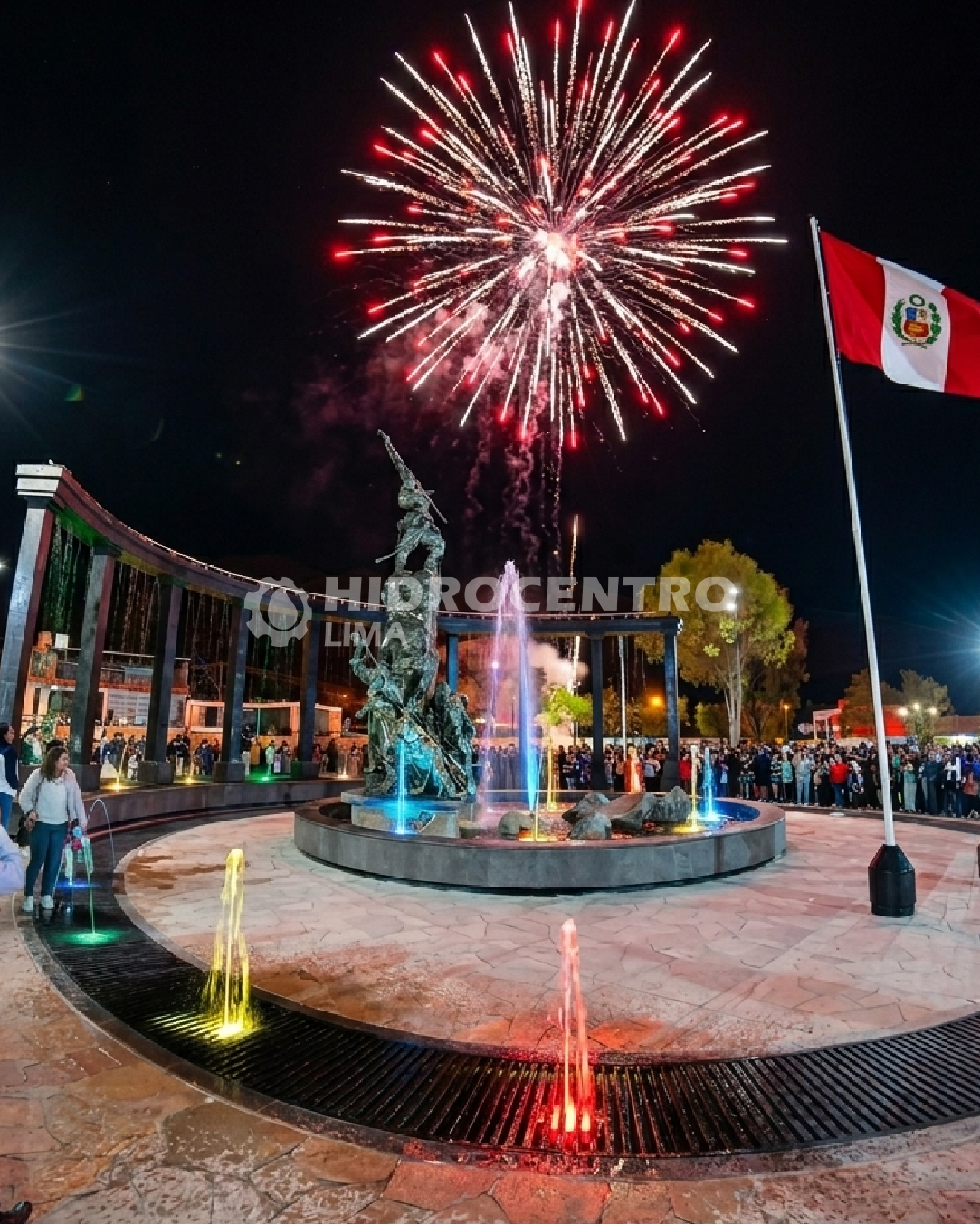 Fuegos artificiales sobre fuente iluminada